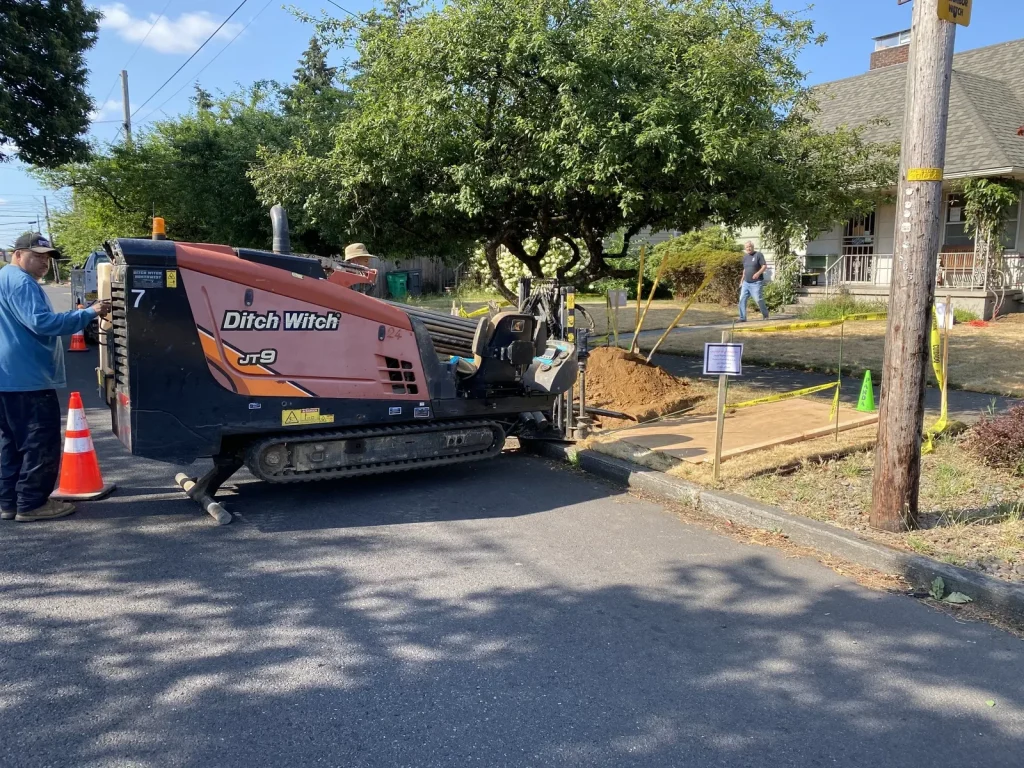 Panda Plumbing directional boring rig replacing a main water line at the curb